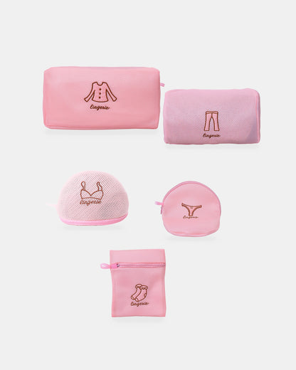 Five-piece pink mesh lingerie wash bag set on a studio background