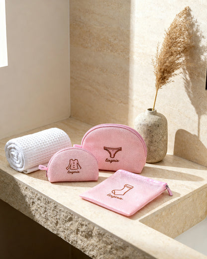 Lingerie wash bags on a stone bathroom vanity ledge